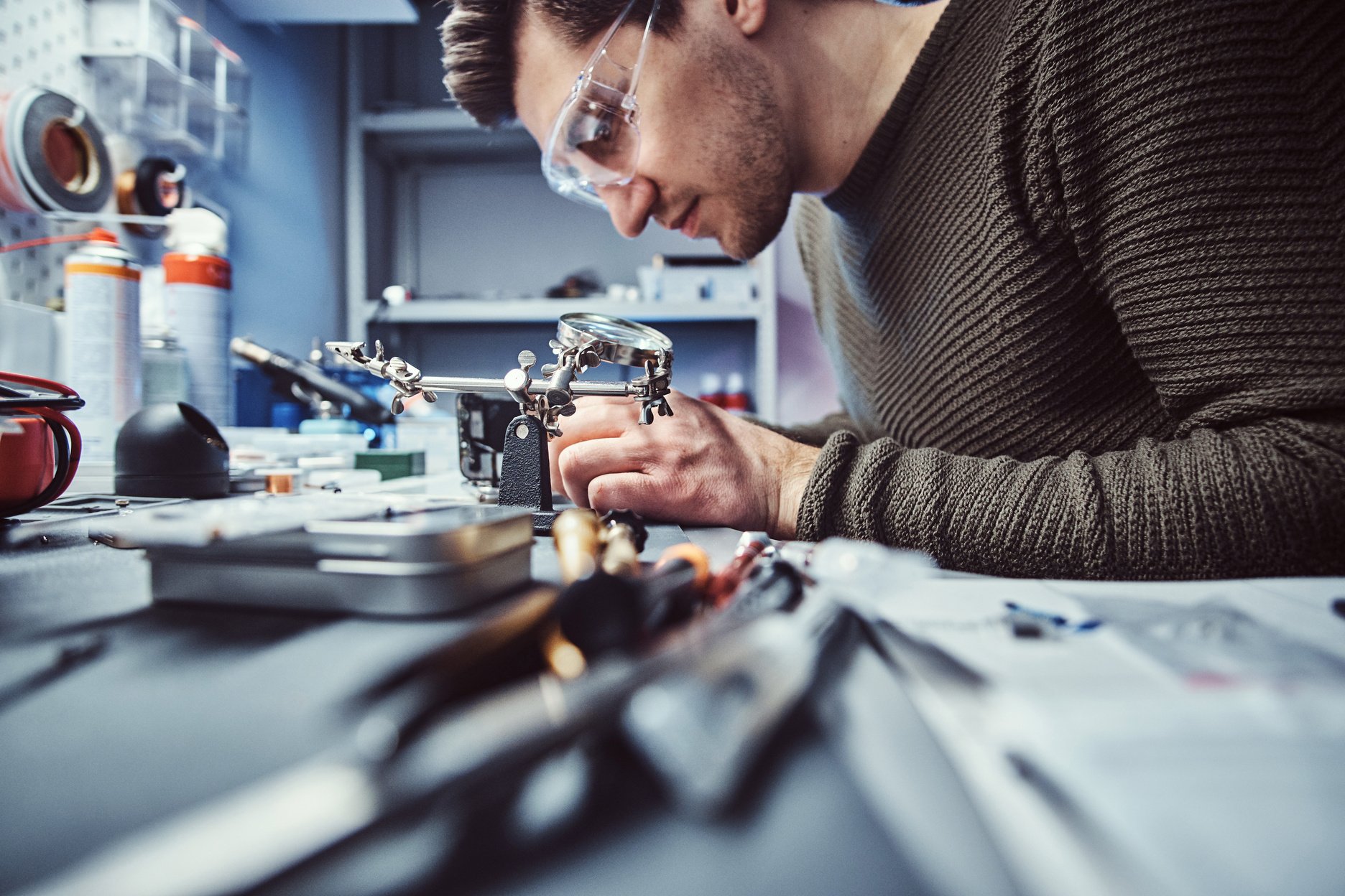 Electronic technician working in the repair shop